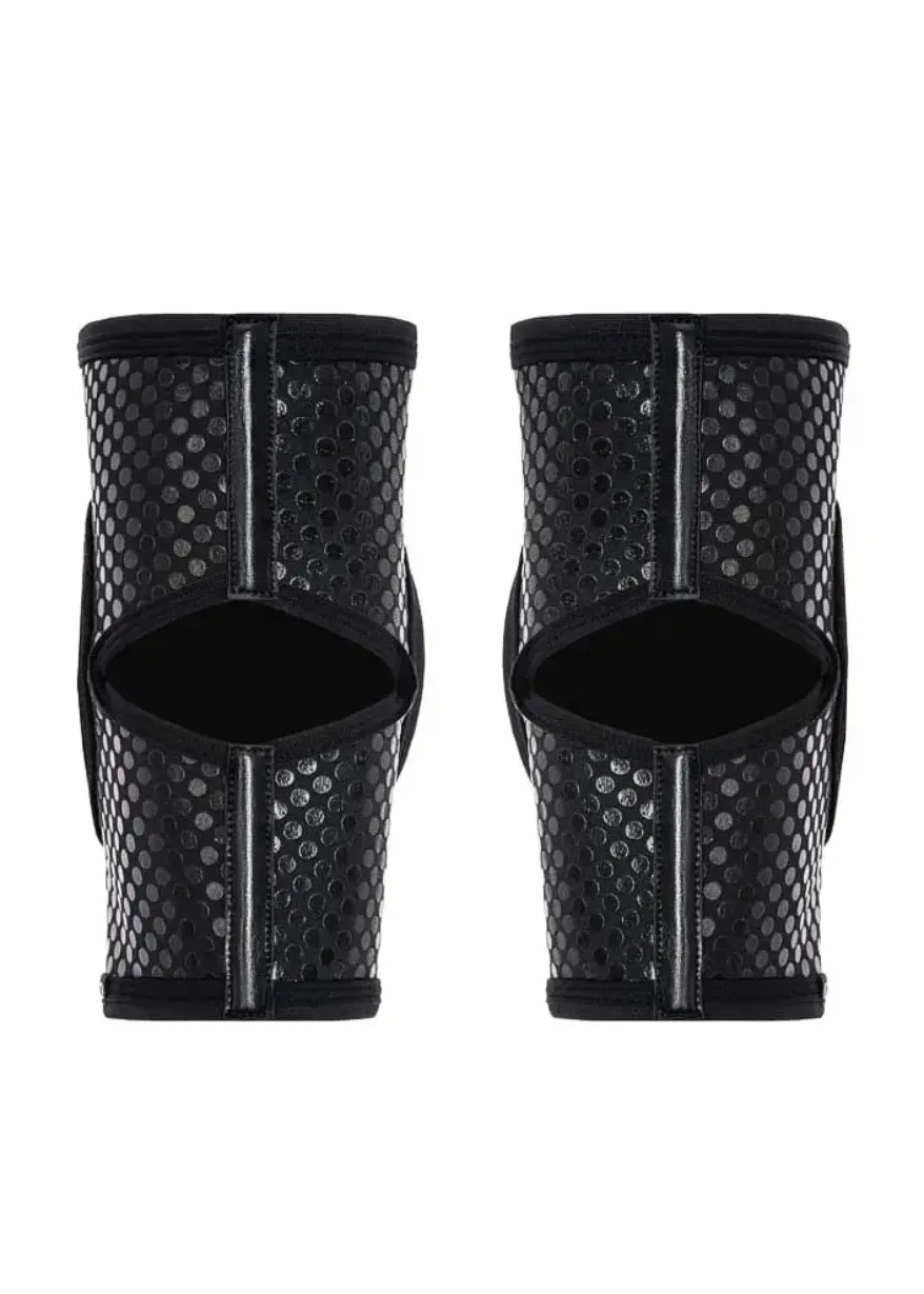 IMG_4275 Pair of black perforated shin guards with open center, designed for leg protection in sports or cosplay.