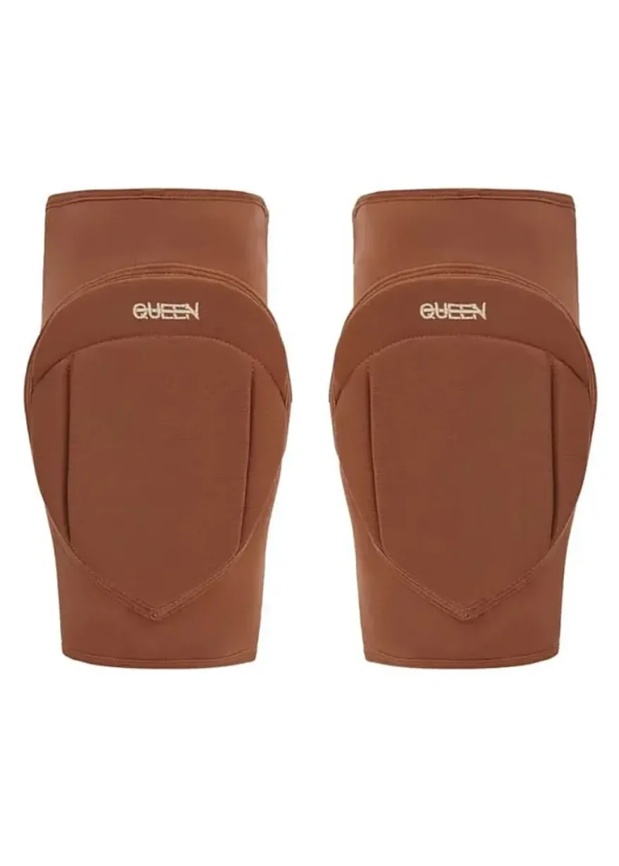IMG_4975 Pair of brown knee pads with curved, molded protective shells and a white QUEEN logo on each pad.
