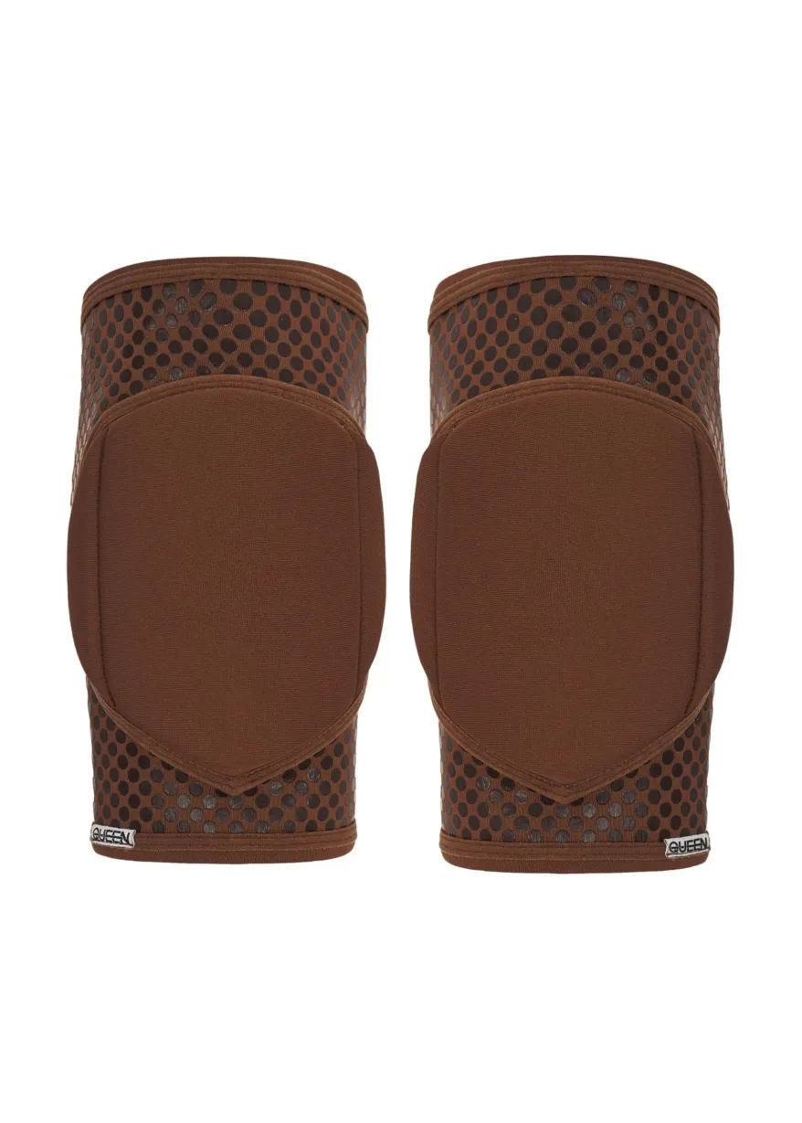 IMG_4541 Pair of brown knee pads with black perforated mesh and solid brown padding, shown side by side in front view.