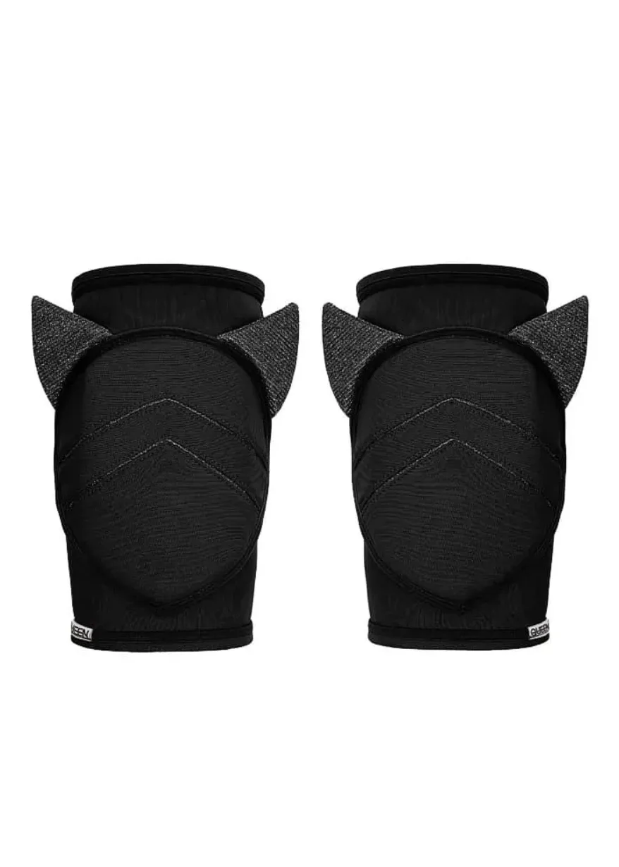 IMG_4560 Pair of black knee pads with ear-like fabric accents, shown from the back for protective gear.