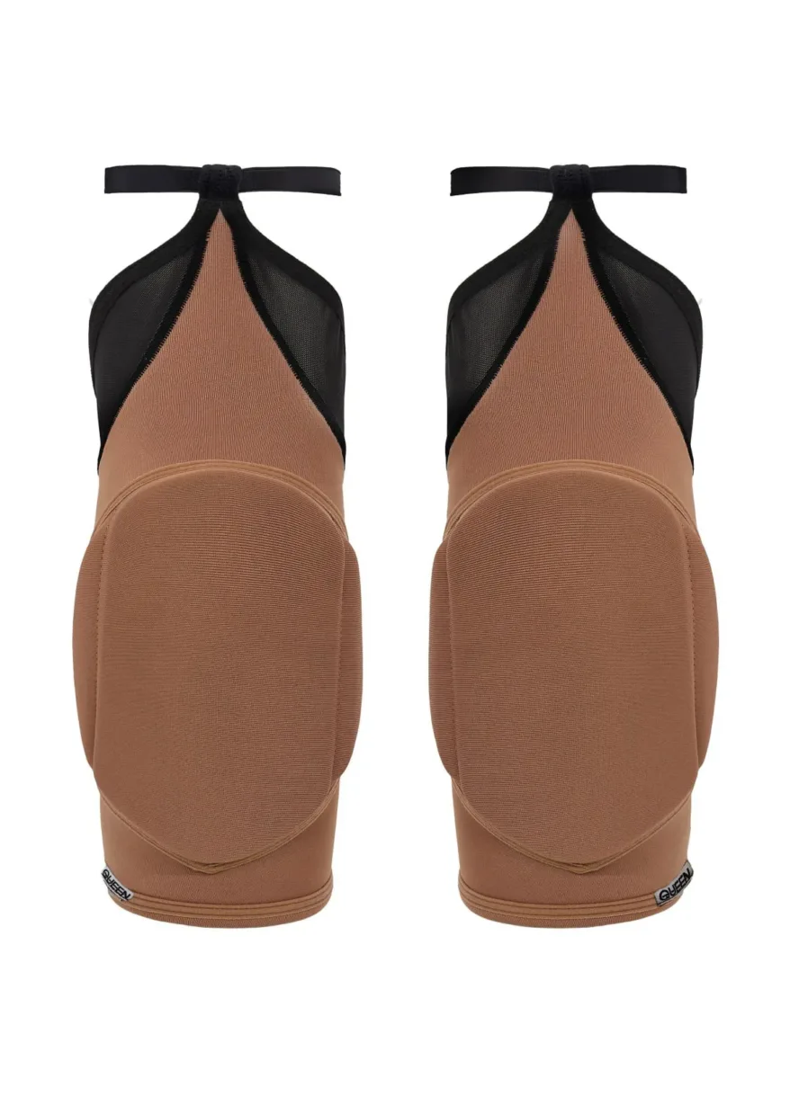 IMG_4552 Pair of tan ballet flats with black mesh panels and ankle straps, shown from the back