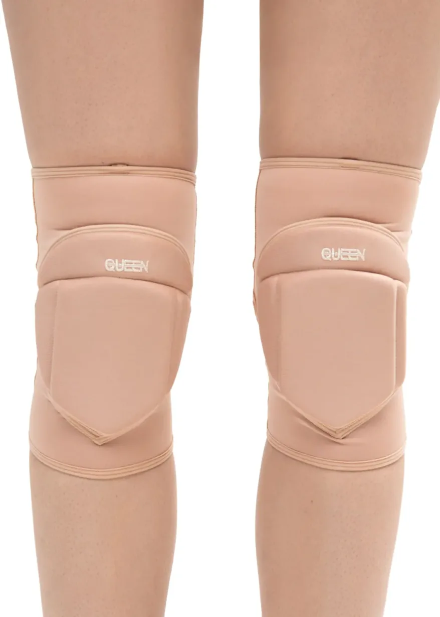 IMG_5937 Beige knee pads worn on both knees, showing protective padding and straps, brand name visible as QUEEN on each pad (side view).