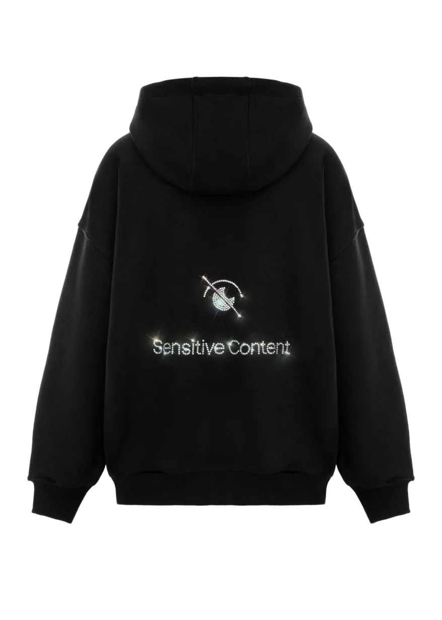 8 Back view of a black hoodie with a sparkling, rhinestone-style 'Sensitive Content' slogan on the lower back area.