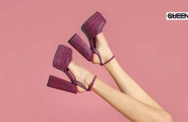 Platform Heels Guide Styles Heights and How to Choose Pink glittery platform sandals on crossed legs against a pink background, with the Queen logo in the corner.