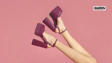 Platform Heels Guide Styles Heights and How to Choose Pink glittery platform sandals on crossed legs against a pink background, with the Queen logo in the corner.